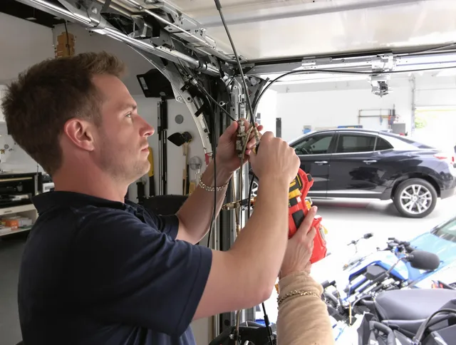 Uxbridge Garage Door Repair safety certified technician performing cable replacement in Uxbridge