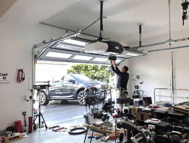 Uxbridge Garage Door Repair specialist installing smart garage door opener system in Uxbridge home