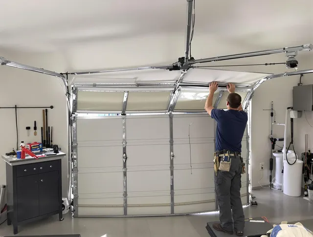 Uxbridge Garage Door Repair specialist performing precise section replacement on Uxbridge garage door